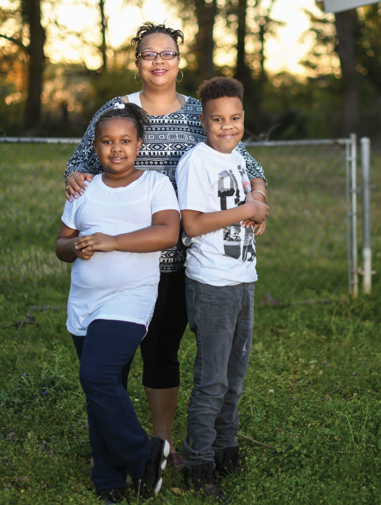 A photo of Formeeca Tripp with her two children.
