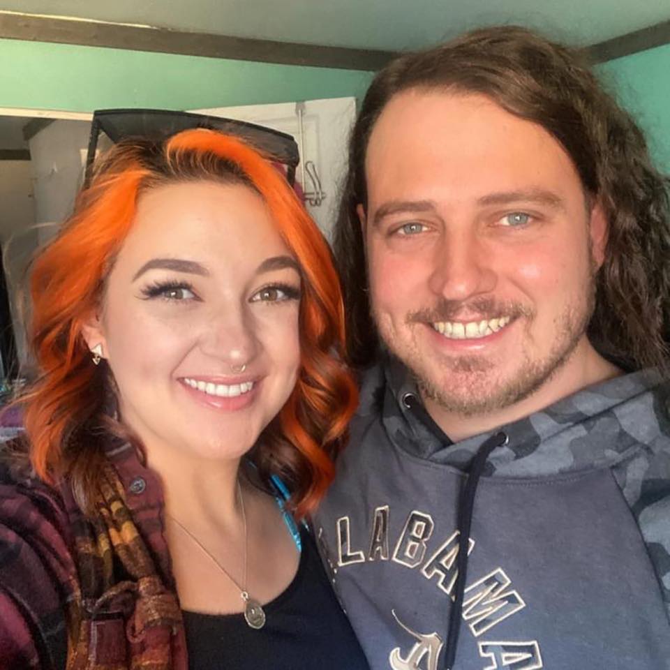 A smiling husband and wife.